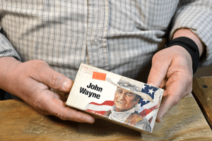 Skip Steinbrecher holds a box of John Wayne brand .32-40 Winchester ammunition. At $69 a box, it's more a conversation piece than anything. Steinbrecher stocks many less-common types of ammunition that can be challenging to find.