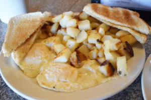 The Grist Mill unofficial “garbage plate” with toast, home fries, and eggs.