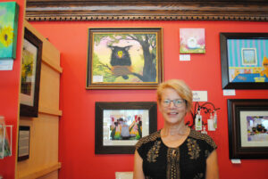 Cindy Schmidt is known as the “Cranky Cat Lady,” with her collection of fun feline items, like paintings and key fobs.