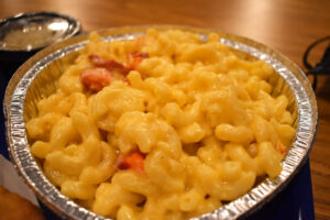 Lobster macaroni and cheese filled with chunks of lobster. The meat is not just on top.