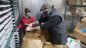A Rescue Mission chef prepares meals for delivery to clients at the Rescue Mission’s facilities in Auburn. During the pandemic, the Rescue Mission has delivered meals to many people in need to limit exposure to the COVID-19 virus. 