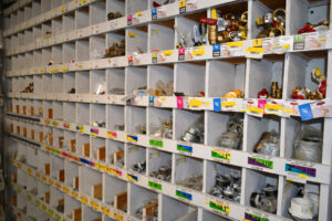 Plumbing supplies line the wall. Hardware store owners have struggled to keep imported items, such as plumbing accessories, in stock. 