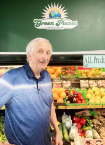 Brent Lewis is the owner of Green Planet Grocery. He started the business in Oswego in 2004; in 2010 he opened a second location in the Fairmount are of Syracuse. He is shown at the Fairmont location.