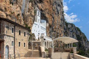 Ostrog Monastery, Montenegro’s most holy site carved into a vertical mountainside, offering a panoramic view of the countryside. 
