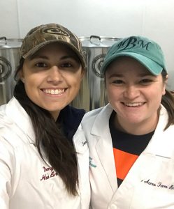 Denyel Busch, left, and Jenna Behling getting ready for a brew day at 6 Acres Farm Brewing.