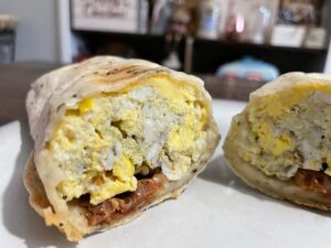 The breakfast burrito ($5): a tightly wrapped three-egg and cheese with choice of meat