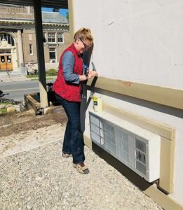 Mayor Deana Michaels working on a beautification project at the Child Advocacy Center.